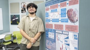 student with red abalone poster