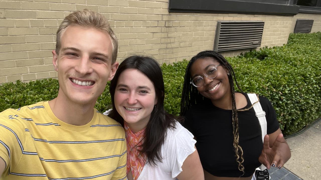 Three people reconnecting in DC