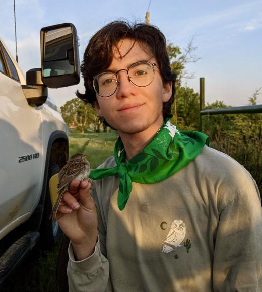 Mason Henry Avelar with a field sparrow