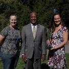 Chancellor Gary May with Brenda Cameron and Rachael Bay. Rachael is holding a lab safety trophy